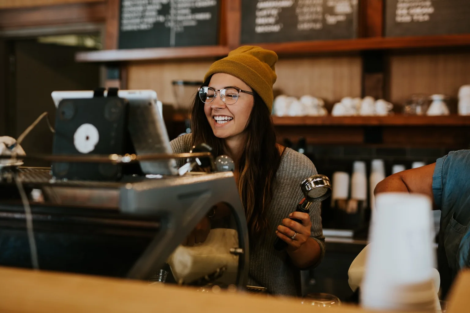 Coffee shop small business owner in Omaha — local SEO services by BDX Omaha driving foot traffic