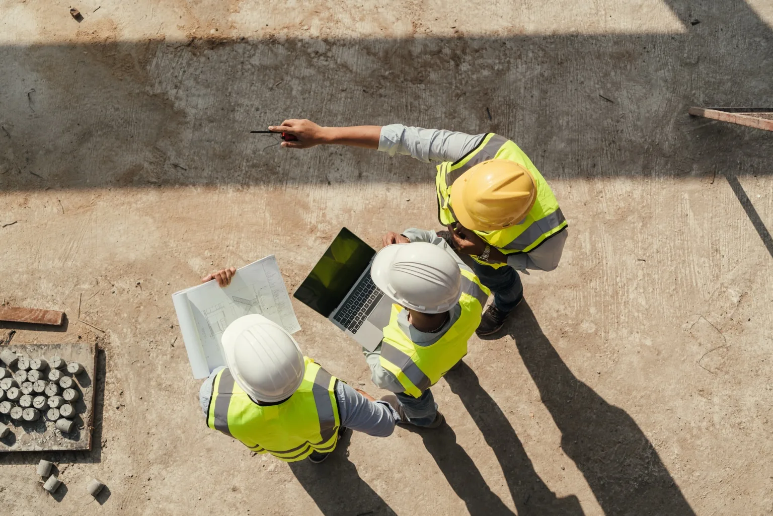 Construction workers site planning overhead — Omaha contractors using local SEO to win more jobs
